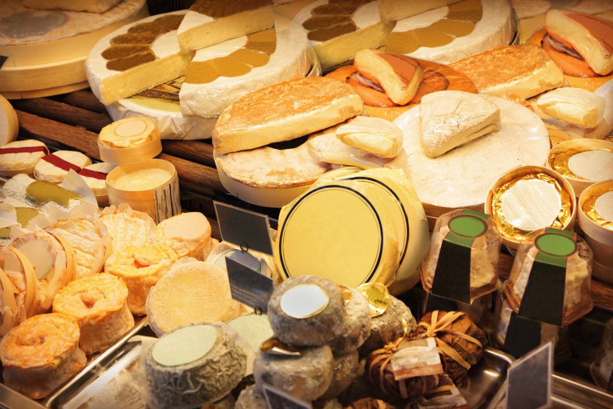 Different cheeses on display.