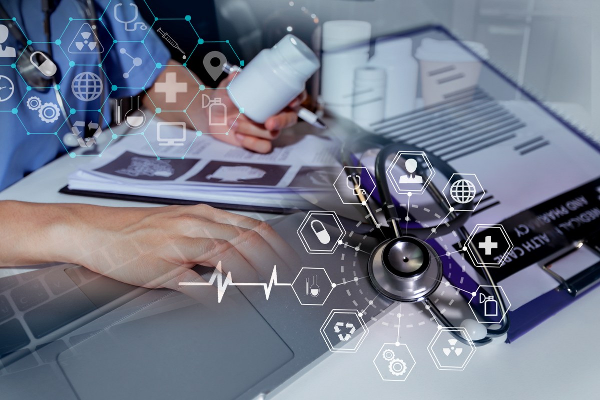 Doctor working on virtual interface icons of healthcare applications.