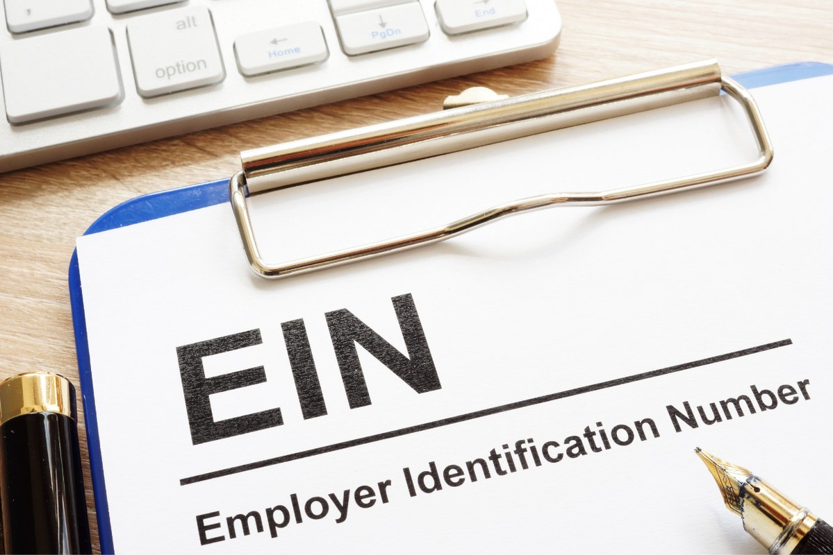 EIN form on clipboard.