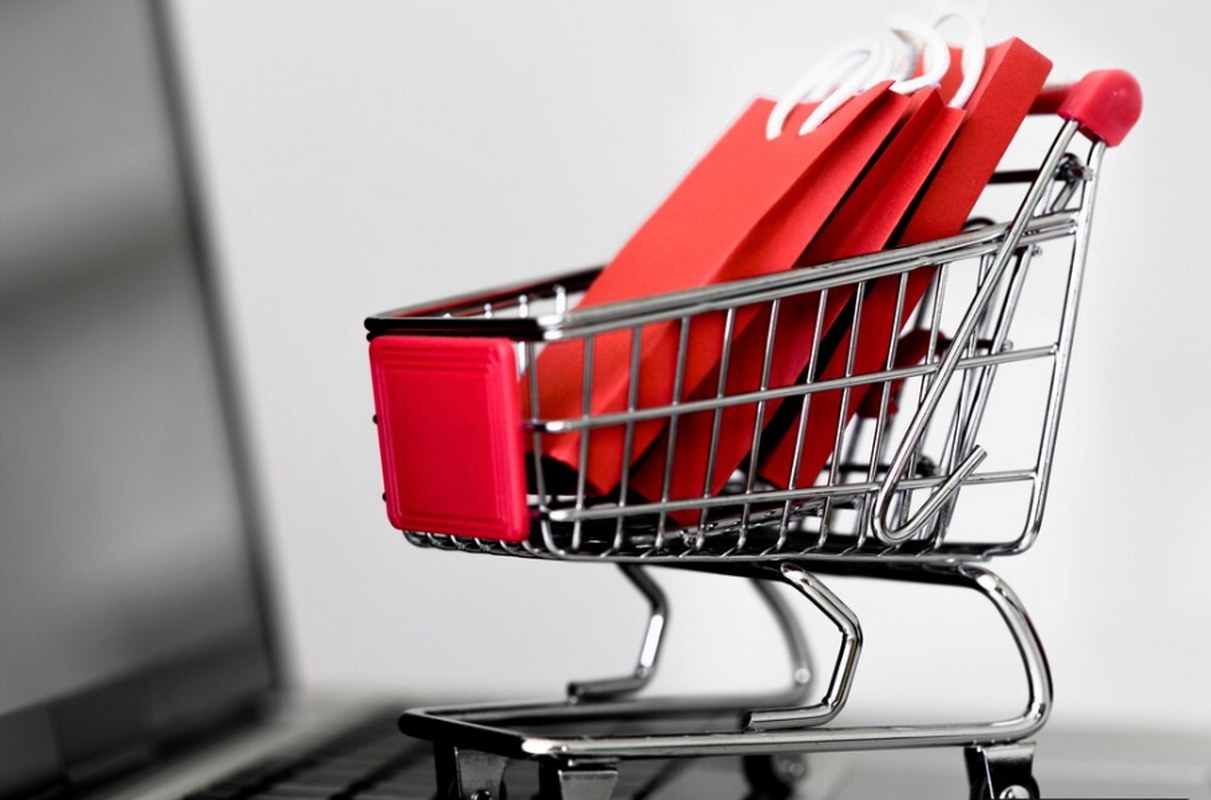 Ecommerce cart on a laptop keyboard.