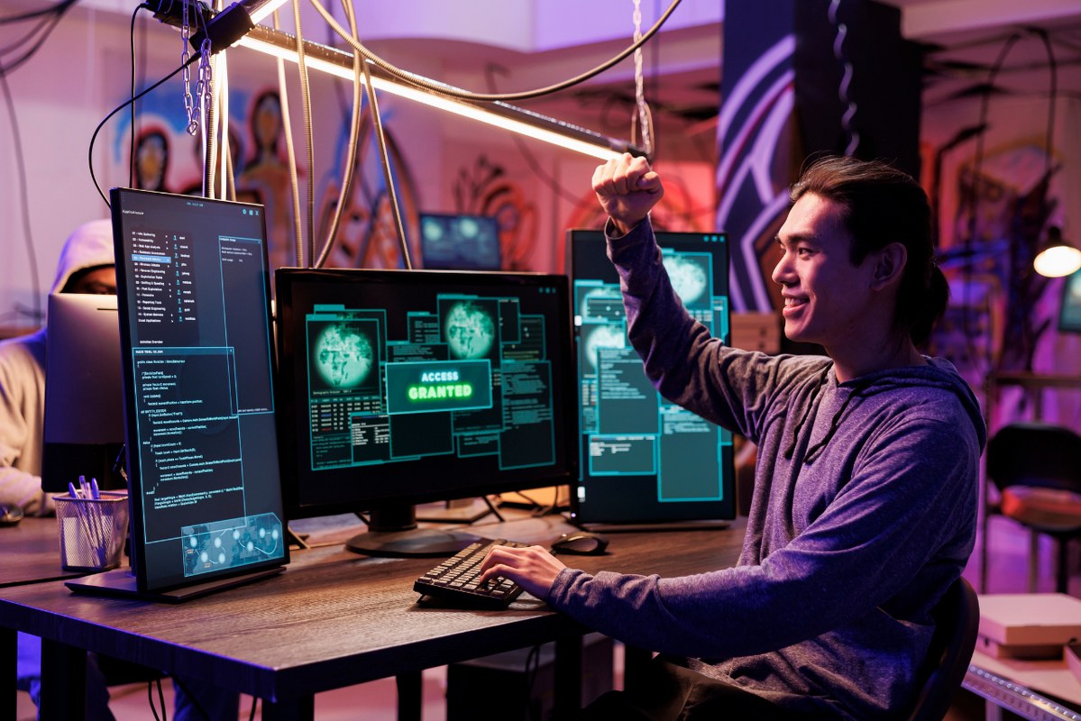 Engineer celebrating successful legal hacking.