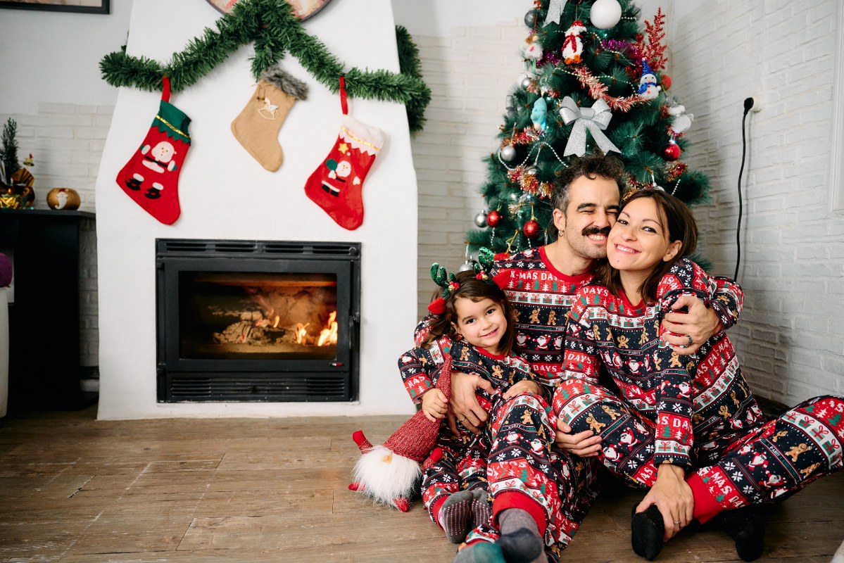 Family wearing matching Christmas pajamas.