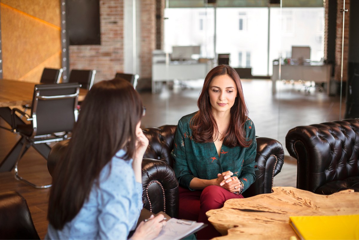 Female Career Counselor Talking to Woman.