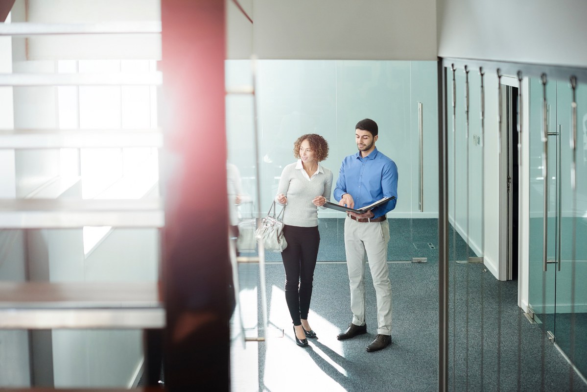 Female buyer shopping for office stuff with male sales person.