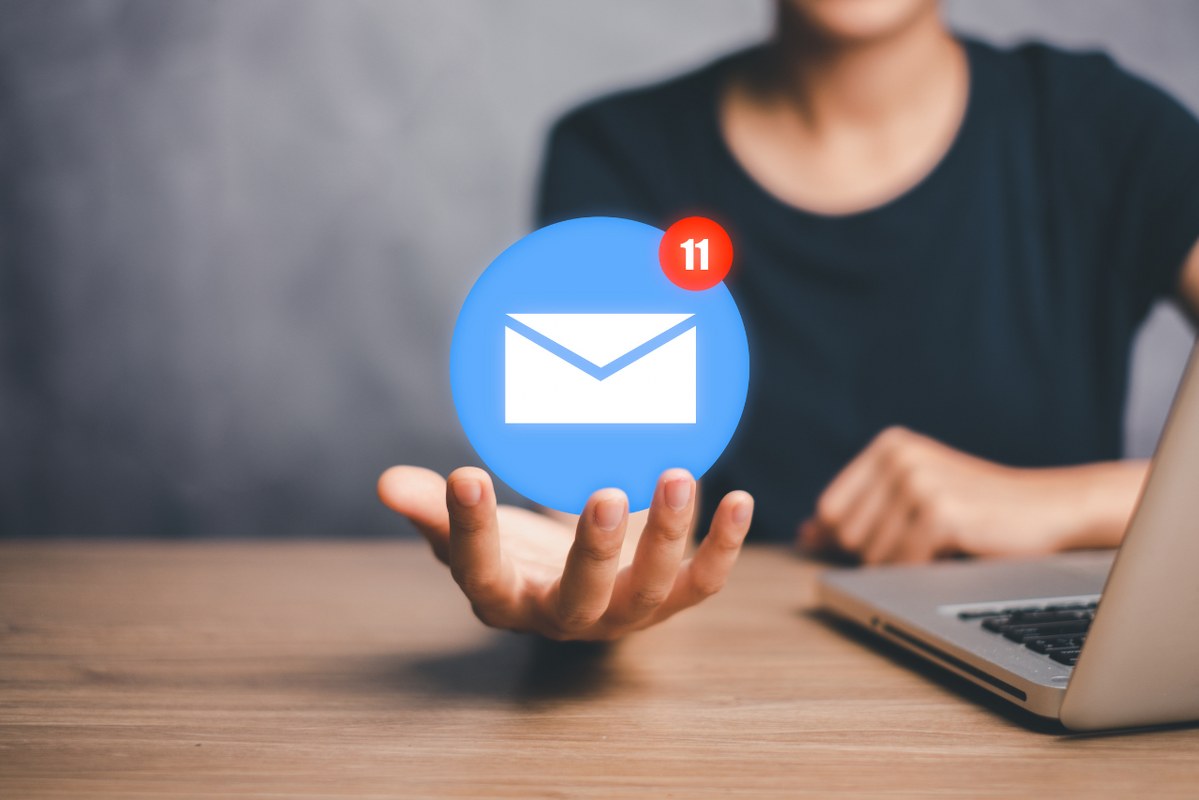 Female customer opens palm while email icon floats.