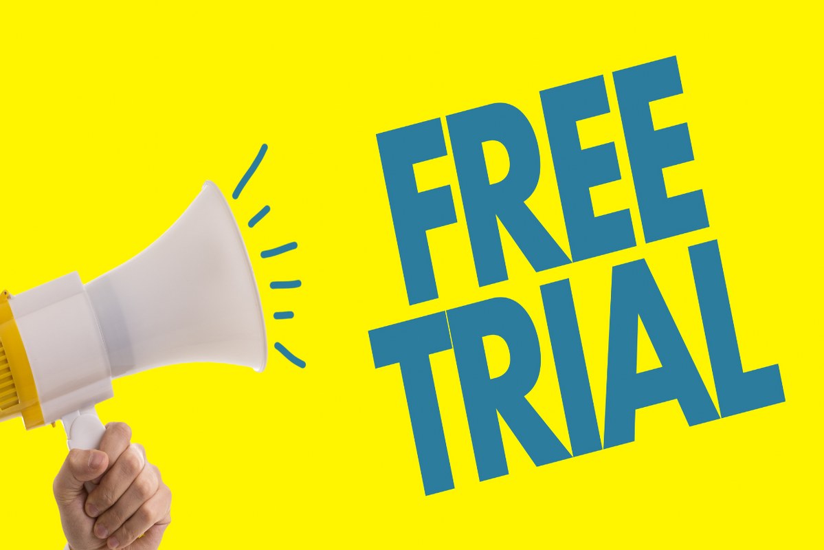 Hand holding megaphone with words Free Trial.