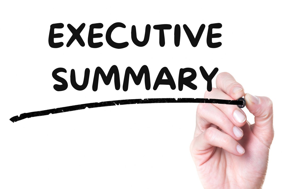 Hand writing words Executive Summary on glass.