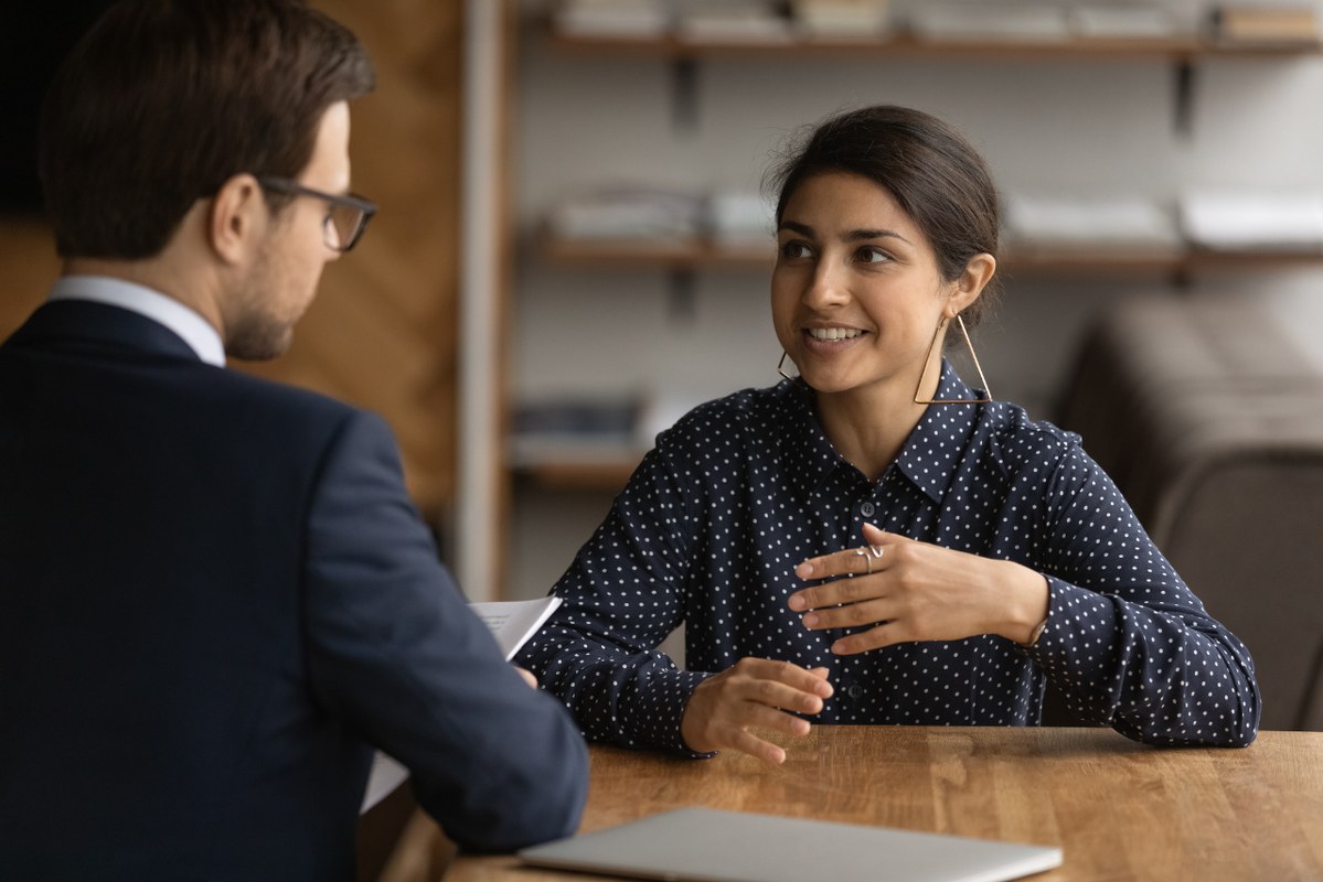 Indian woman talk to her employer.