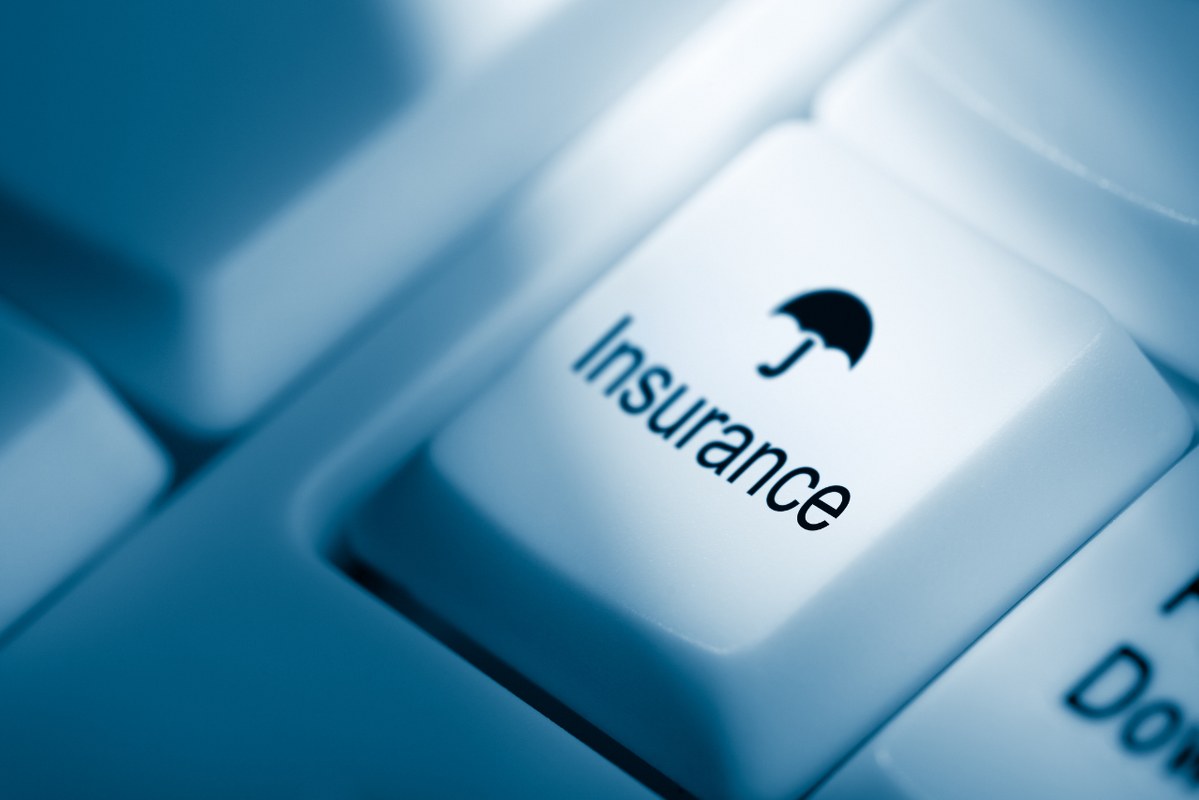 Insurance key on computer keyboard.