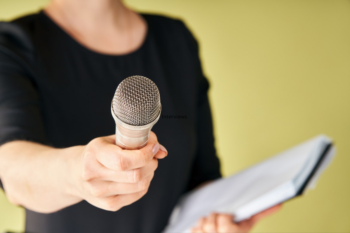 Journalist with Microphone Interviewing You.