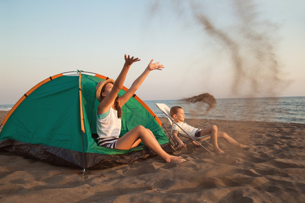 Kids camping and activity on the beach.