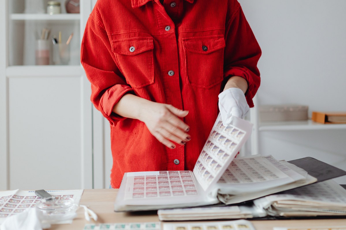 Lady cleaning and preserving stamps.