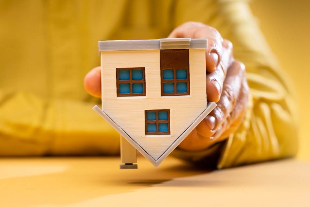 Literal flipping of miniature house.