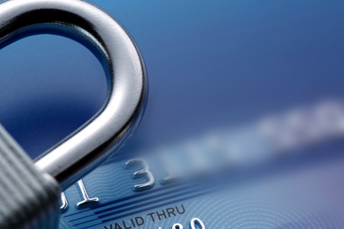 Macro shot of lock and creditcard.