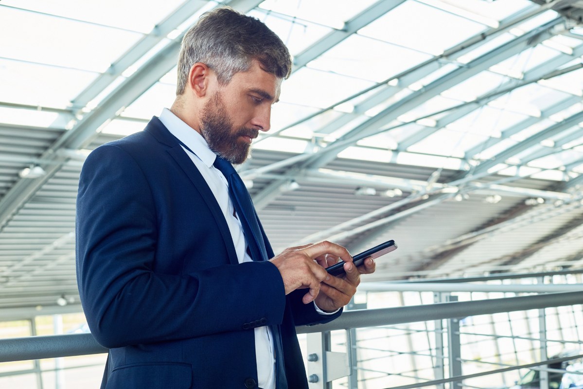 Male assistant responding to online message quickly.