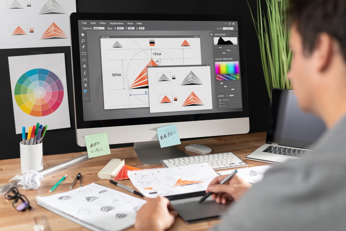 Male graphic designer working on logos.