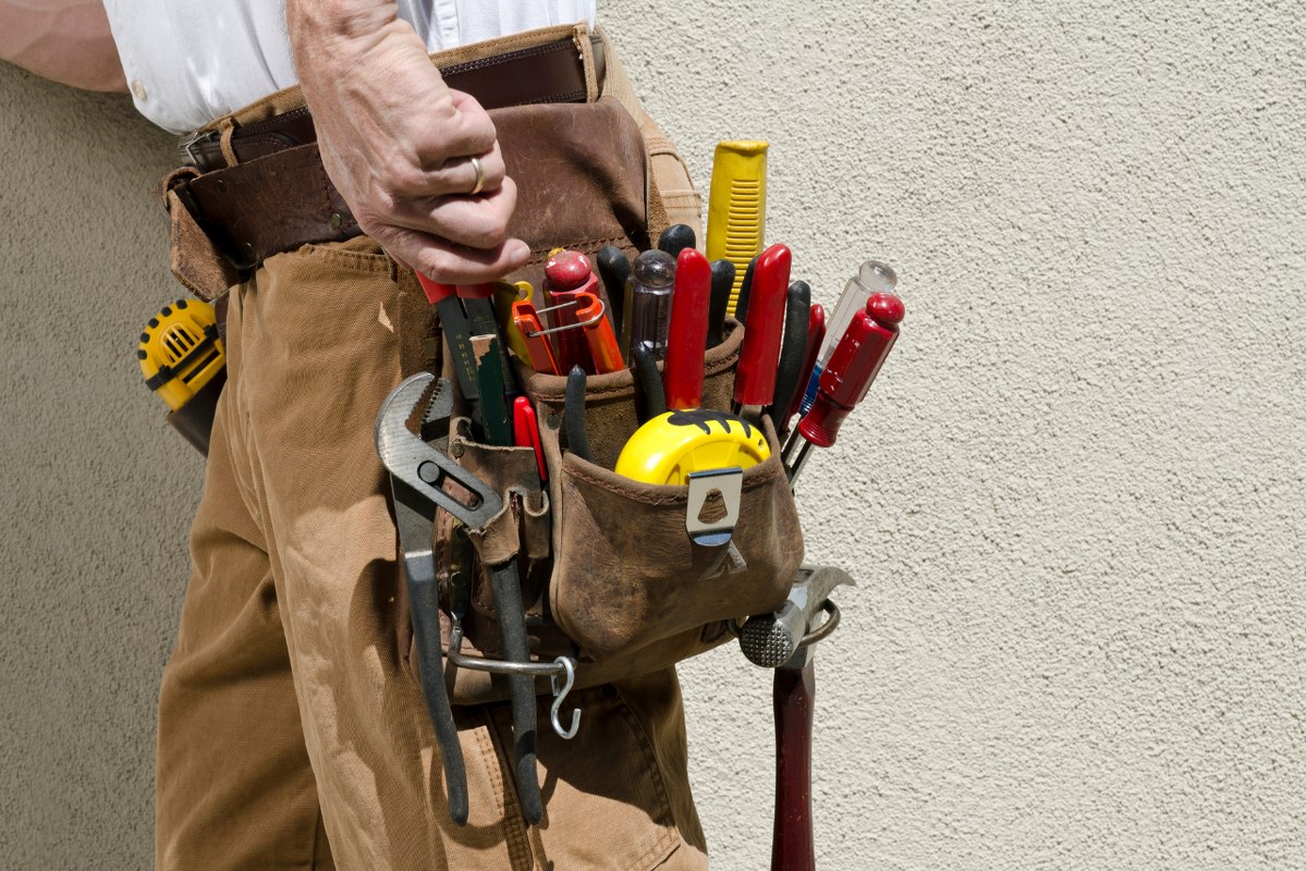 Male handyman with tool belt.