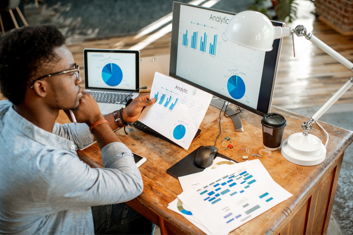 Man serioulsy looks at Analytical data before deciding.