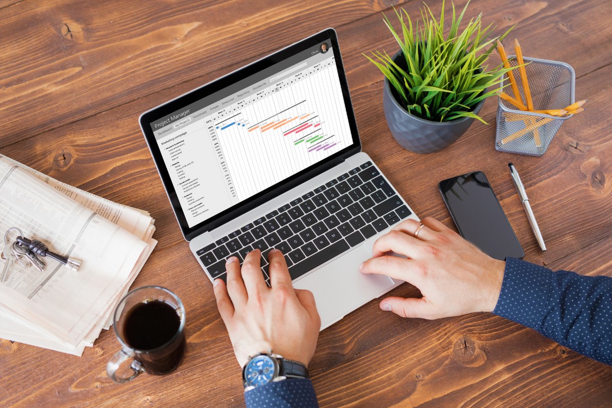 Man using project management software to stay on top of tasks.