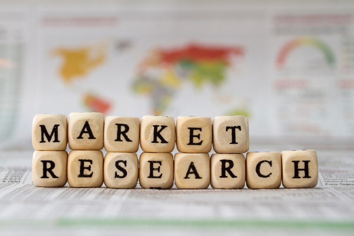 Market research words built with wooden cubes.