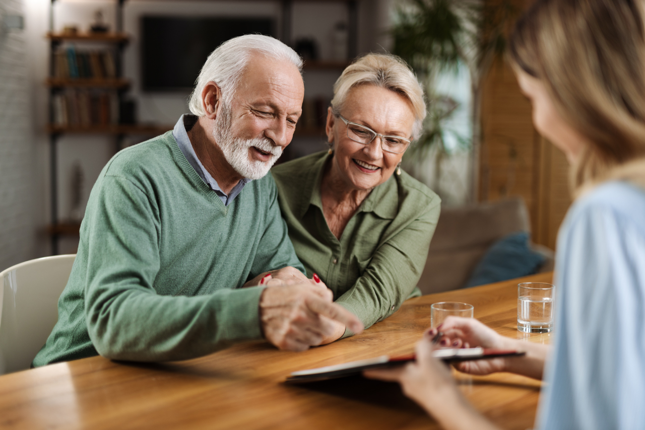 Mature couple having a meeting with their financial advisor.