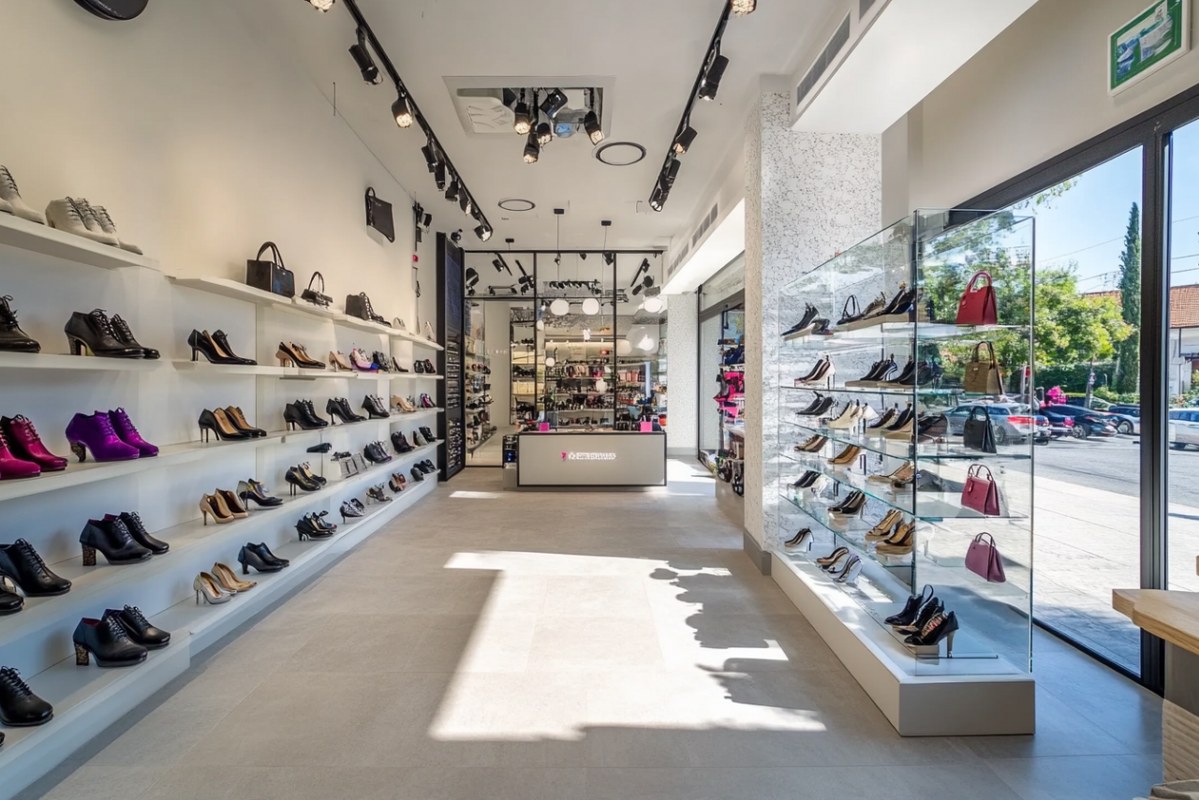 Modern Shoe Retail Store Interior with Display Shelves.