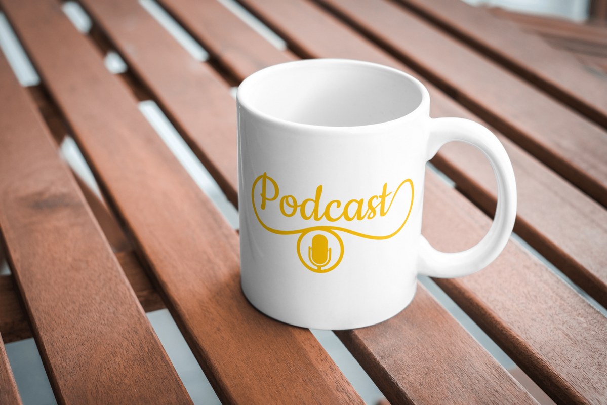 Mug with podcast logo on it.