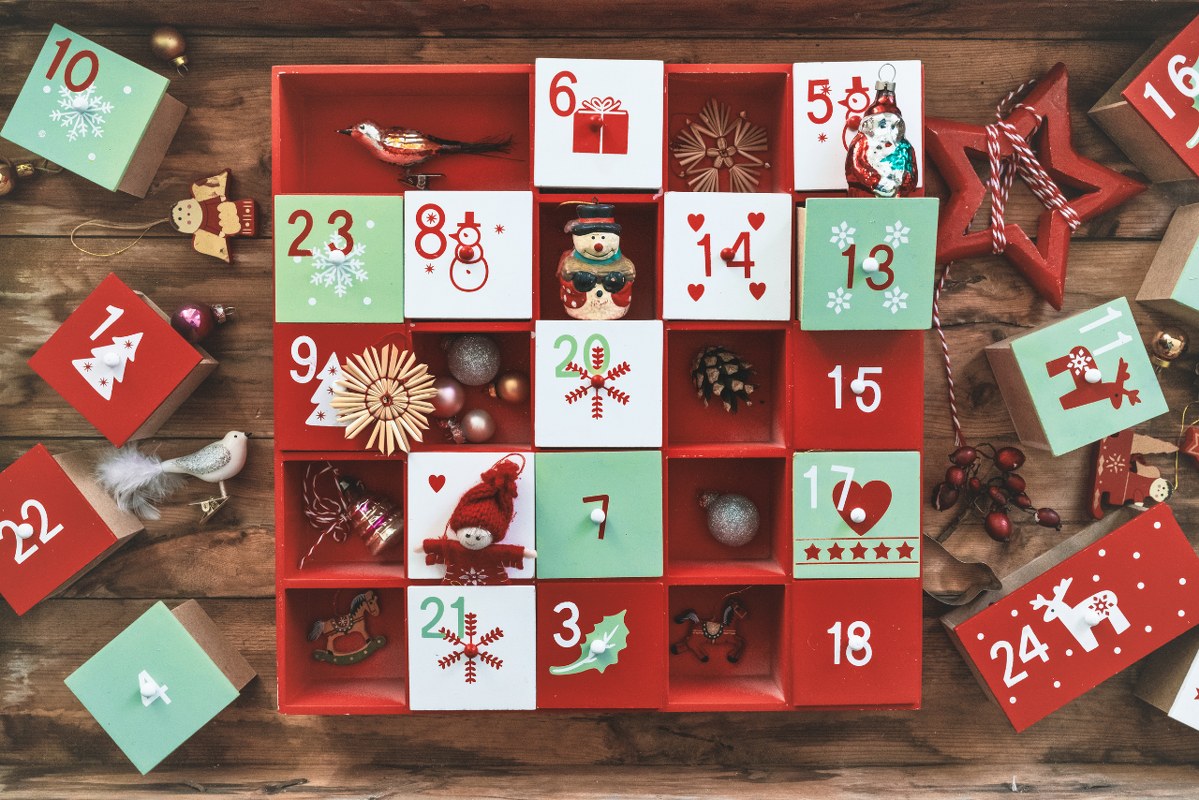 Old wooden advent calendar with vintage decoration.