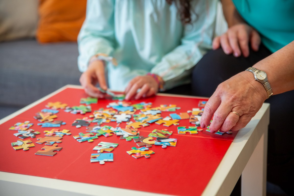 People Playing Puzzle.