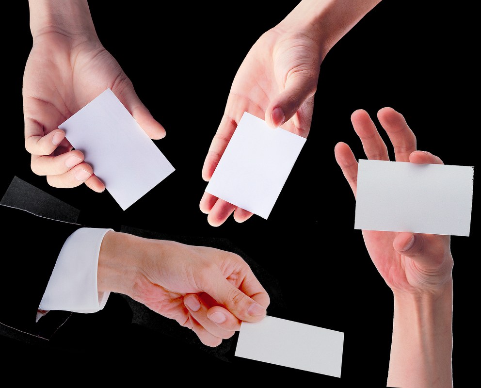 People selecting blank cards.