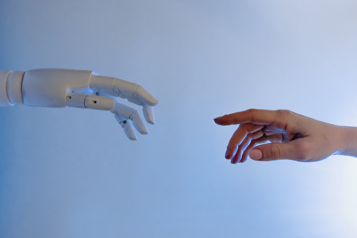 Person Reaching Out to a Robot.