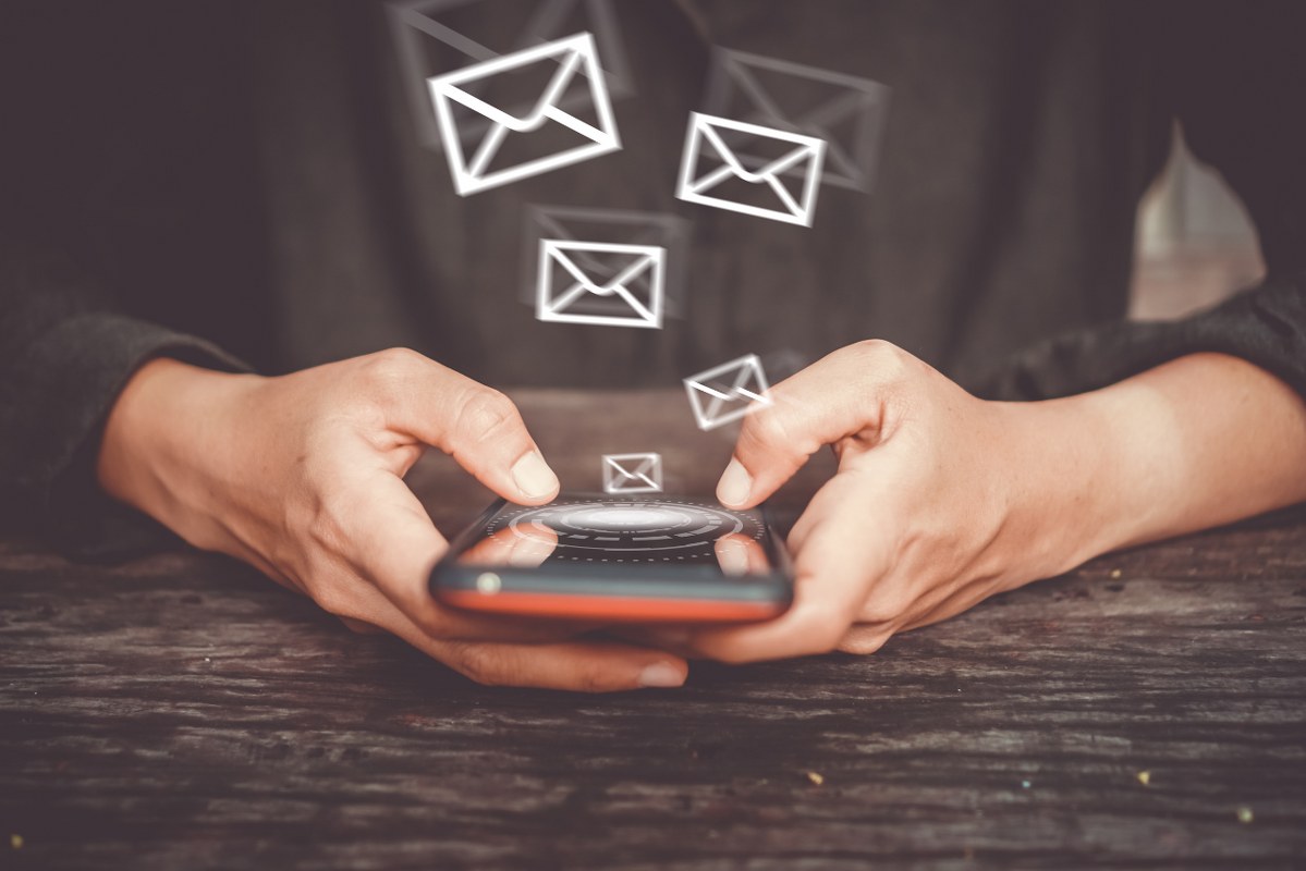 Person Using Smartphone to Send and Recieve Email.
