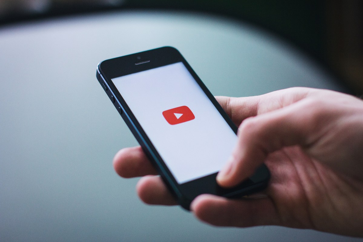 Person accessing youtube on phone.