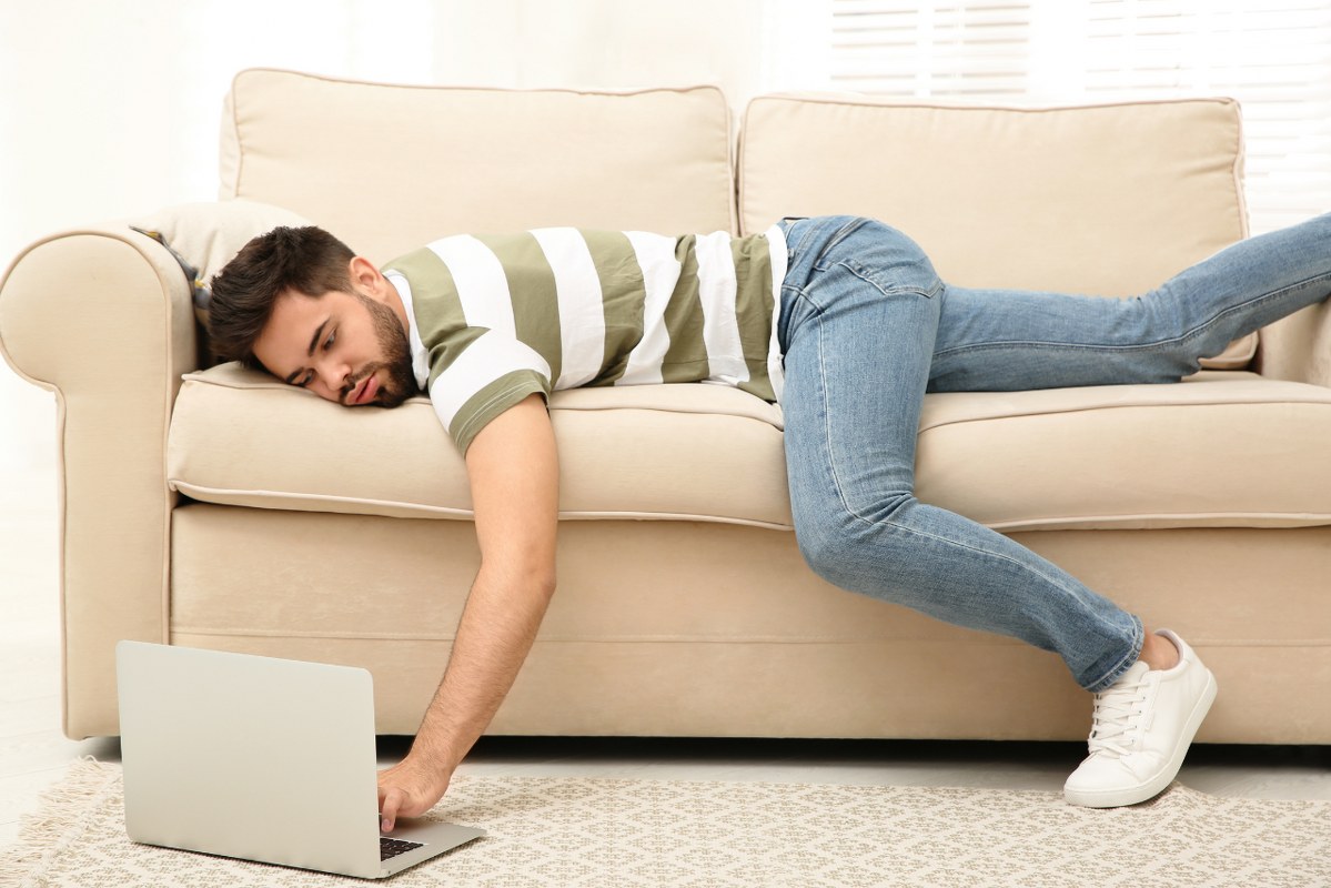 Person laid back while working, overly relying on AI.