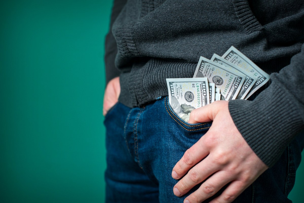 Person's Pocket Full of Cash.