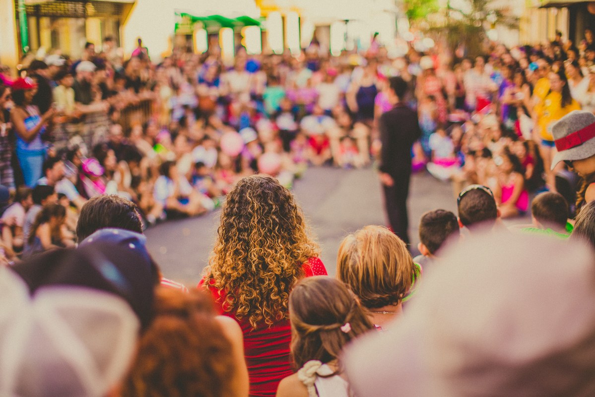Photo of People Watching a Live street performance.