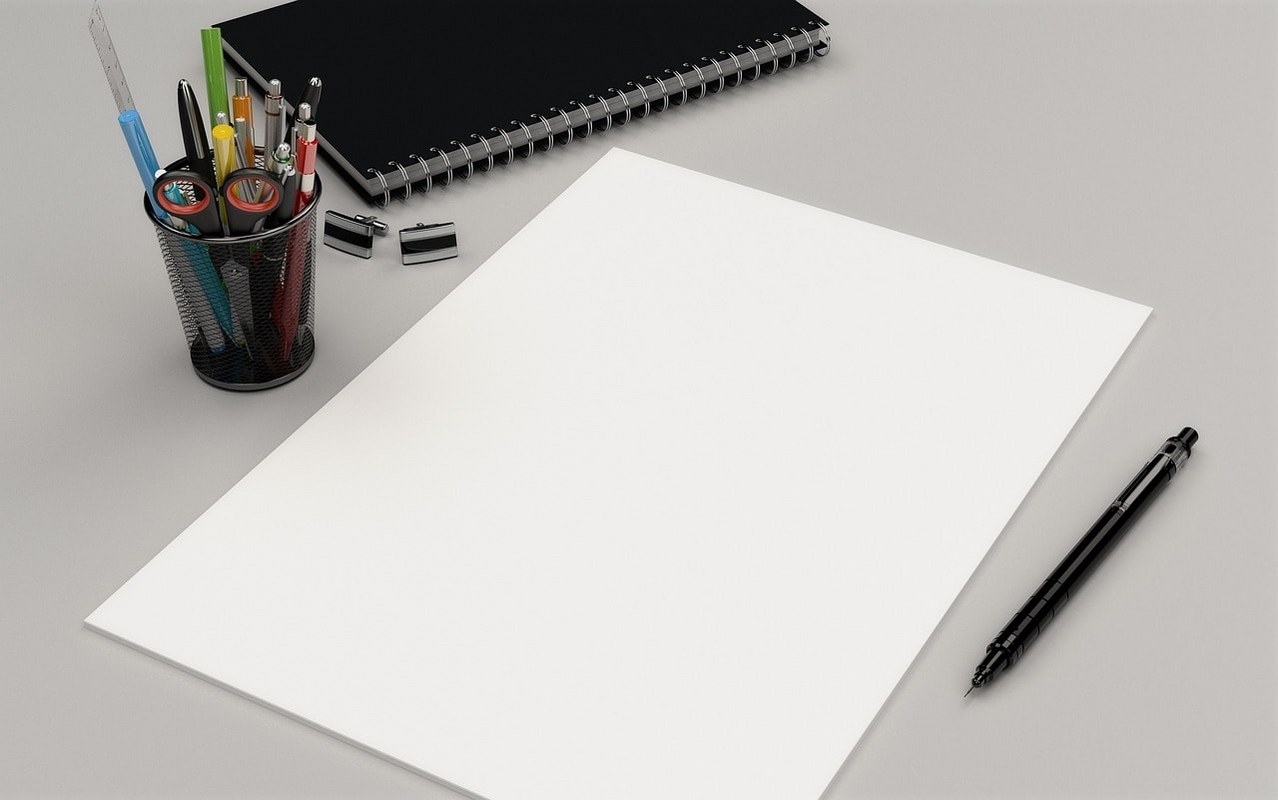 Plain A4 paper and pens for writing.