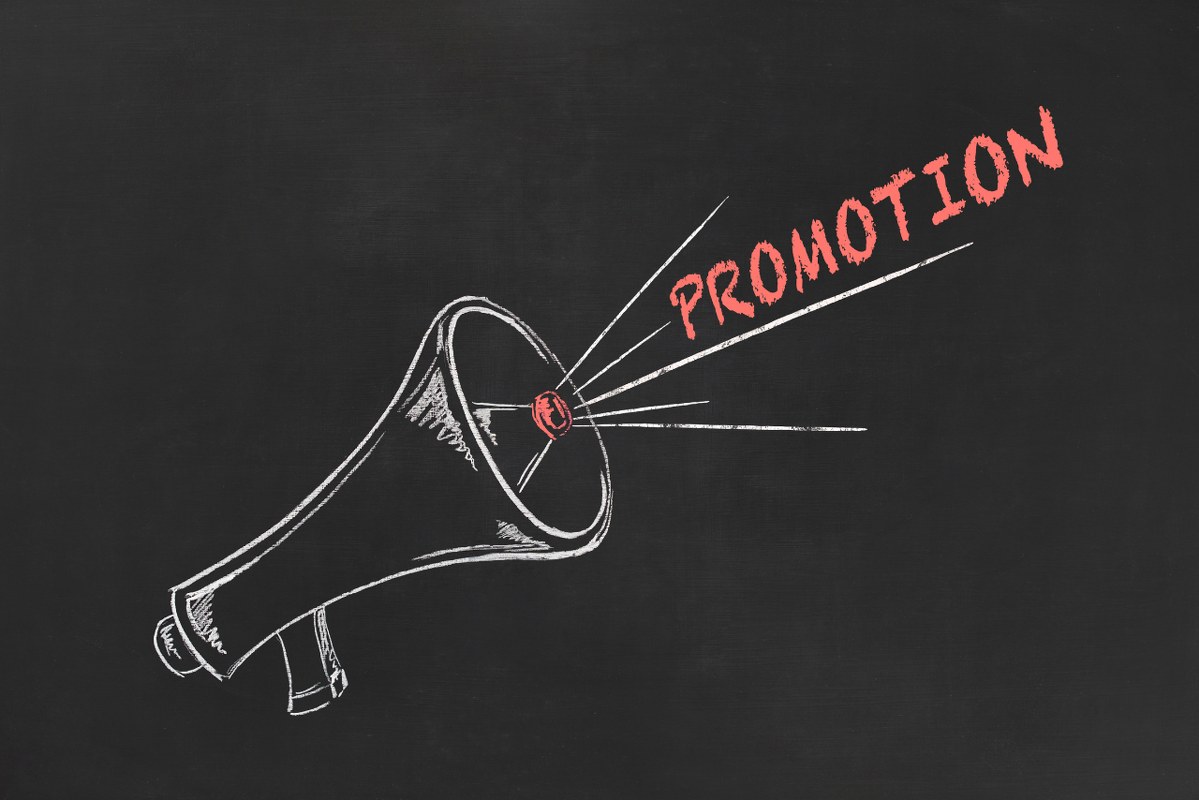 Promotion hand drawing megaphone on blackboard.