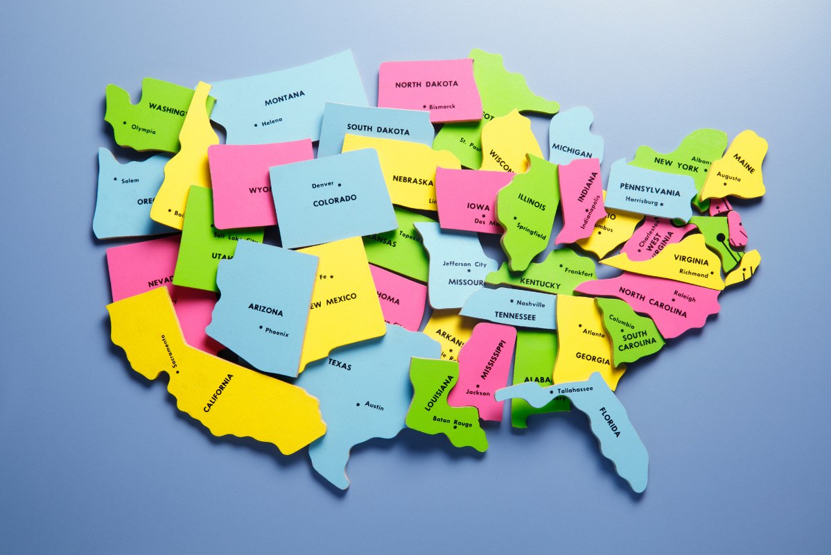 Randomly Placed Puzzle Pieces Representing The 50 states Of The United States.