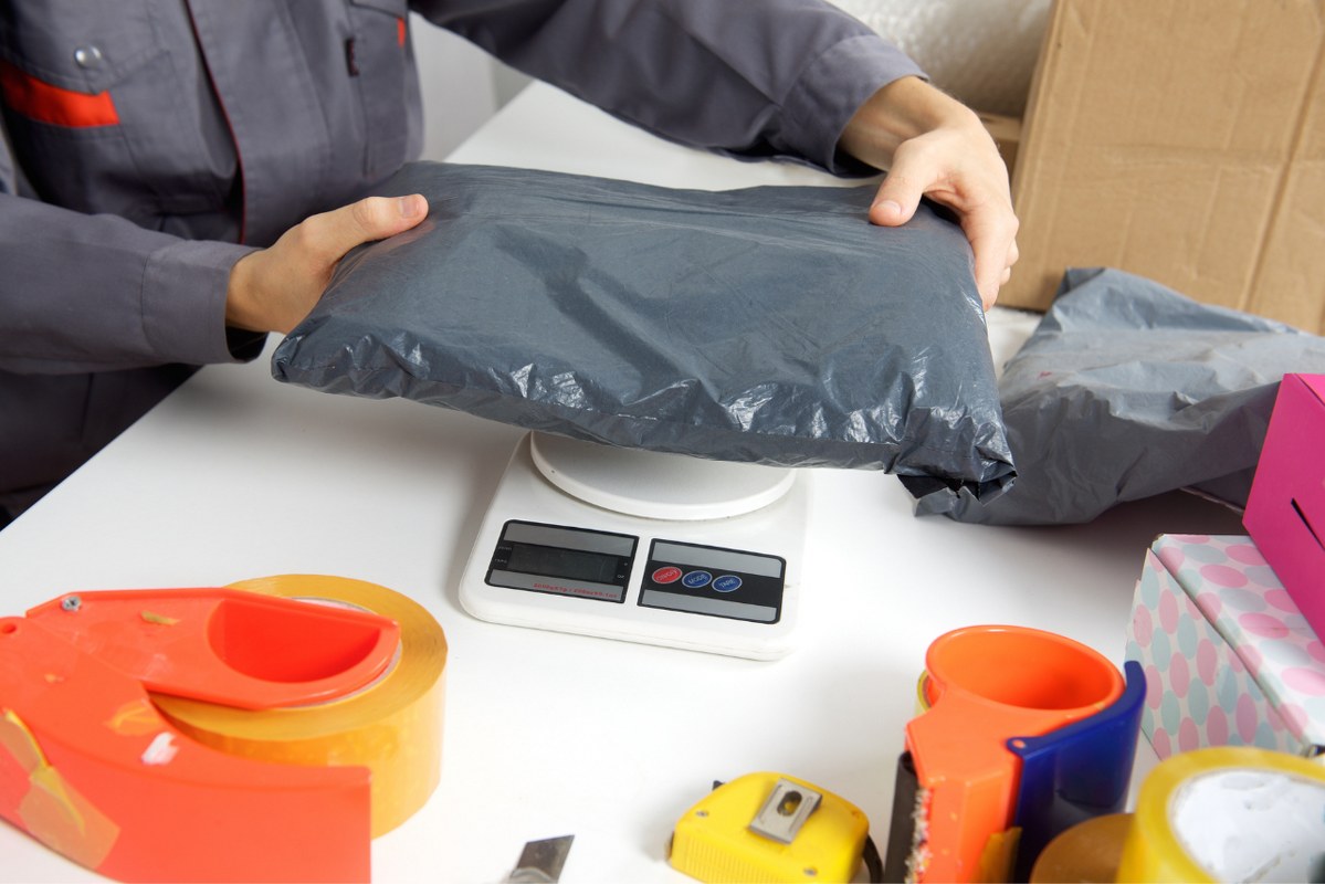 Seller weighs parcel.