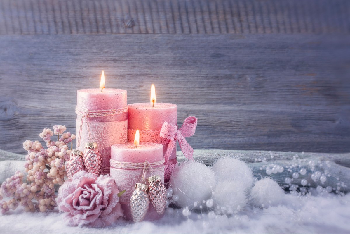 Set of pretty pink christmas candles.