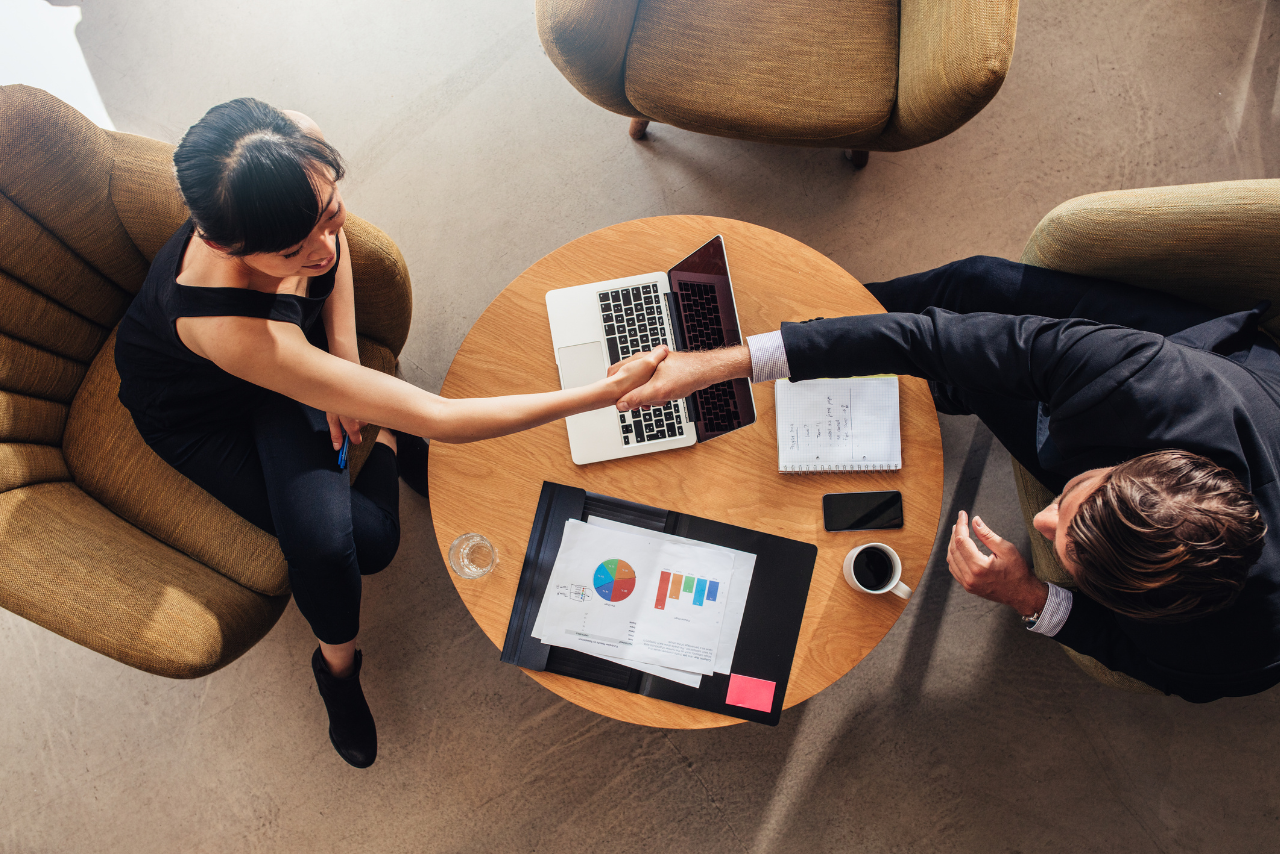 Shaking hands with a female client.