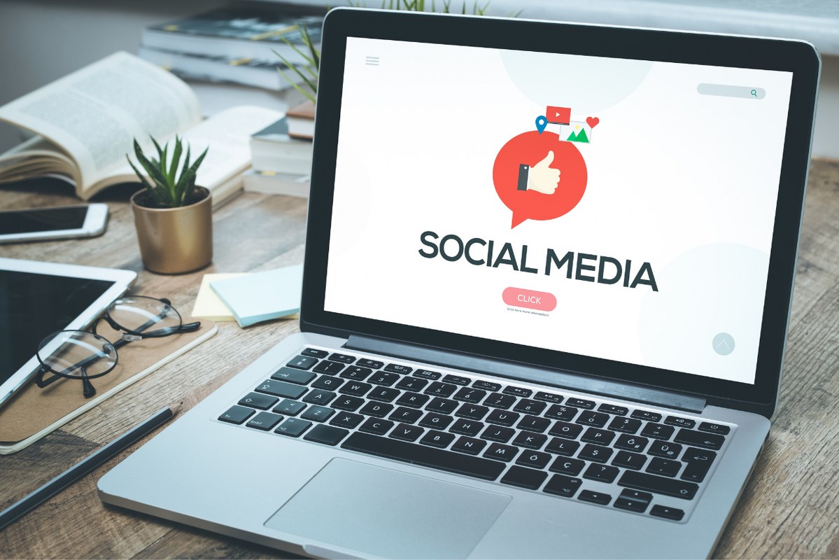 Social media displayed on laptop screen.