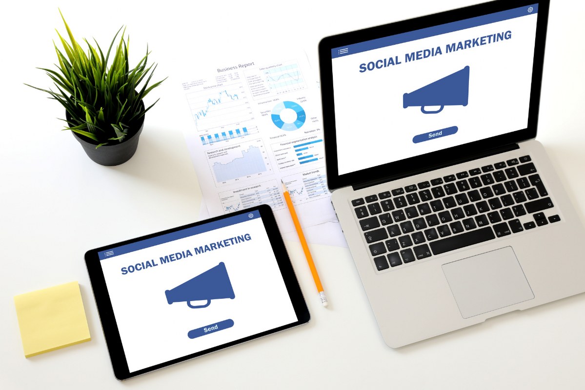 Social media marketing network communication laptop tablet.