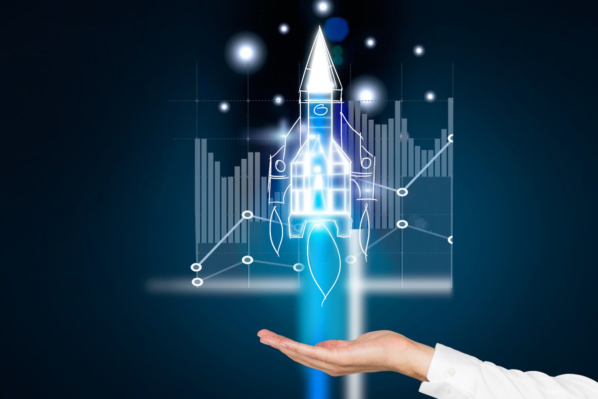 Startup rocket and business chart.