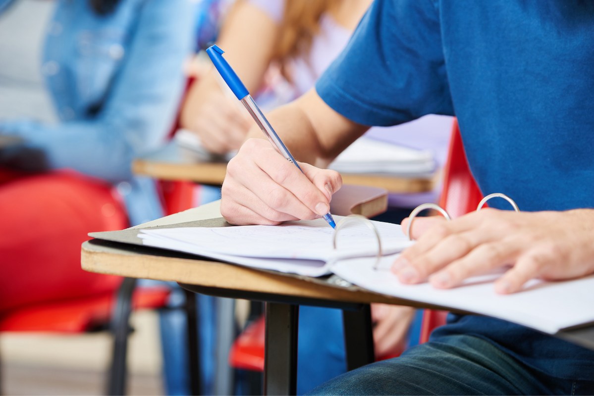 Student Taking Notes during class.