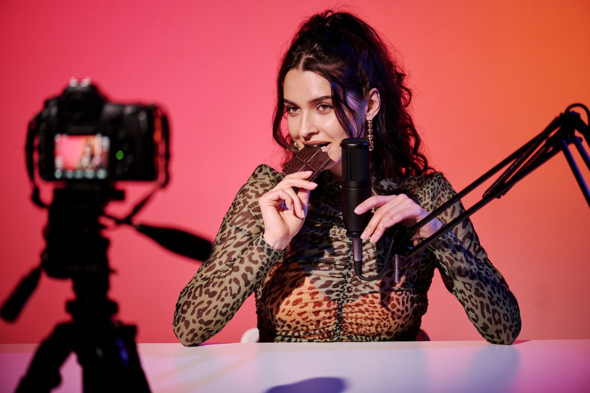 Stylish Blogger Eating Chocolate Bar.