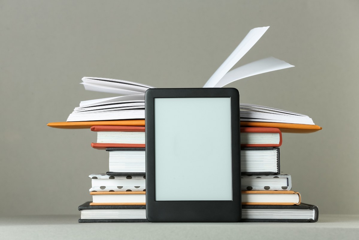 Tablet with books at the back.