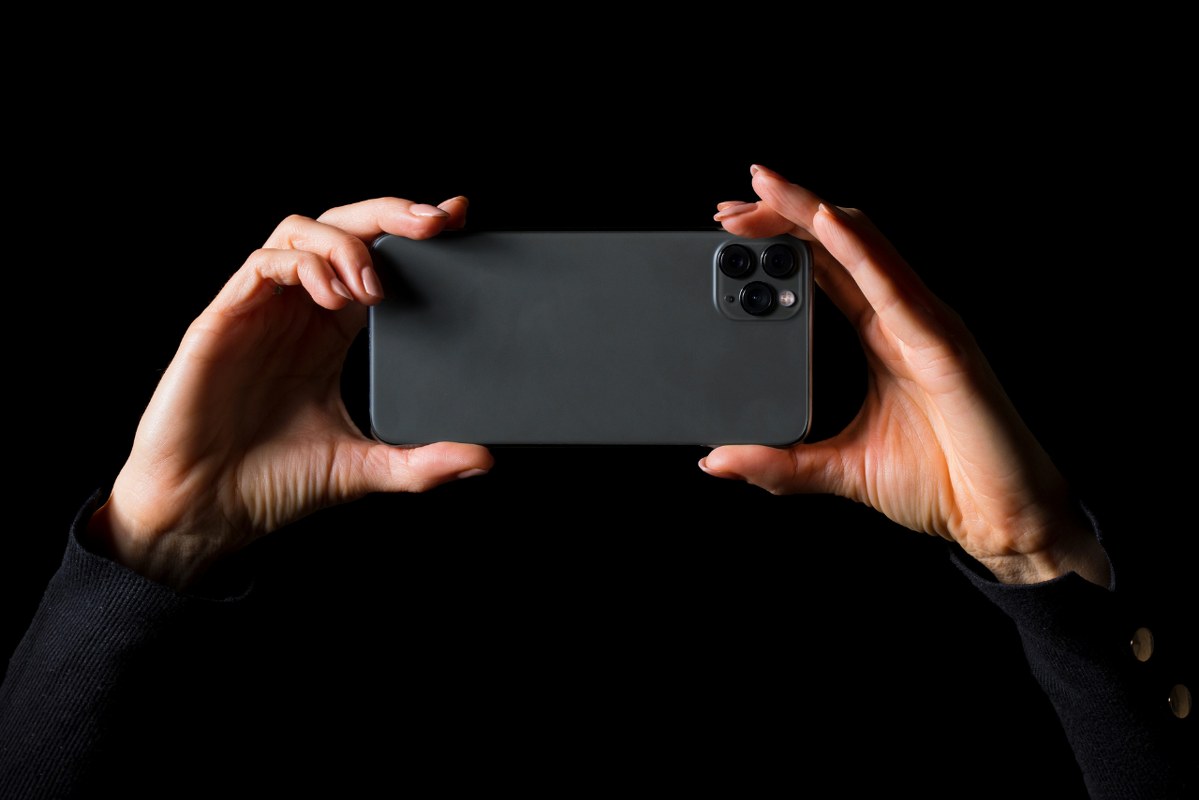 Taking photo using phone.