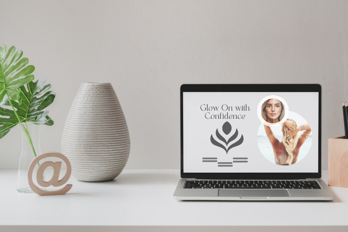 Tanning business website displayed on laptop screen.